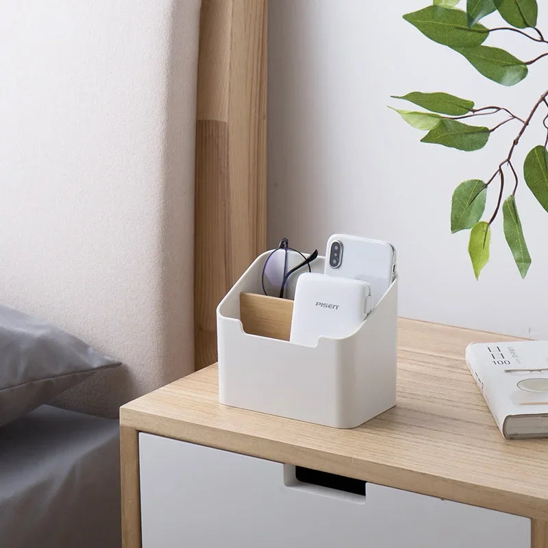 White plastic desktop storage box holding eyeglasses and small personal items
