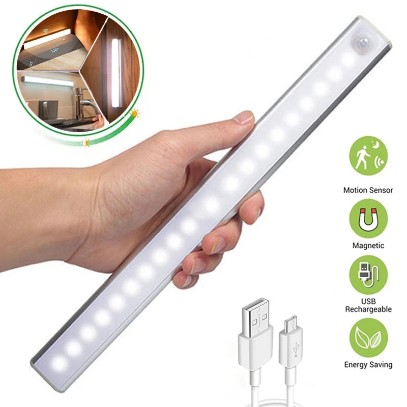 White rechargeable LED night light bar with motion sensor, held in hand