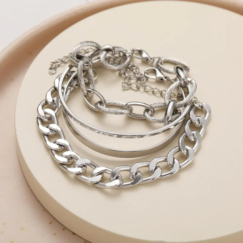 Silver-tone chain bracelet set with chunky links and oval open bangles