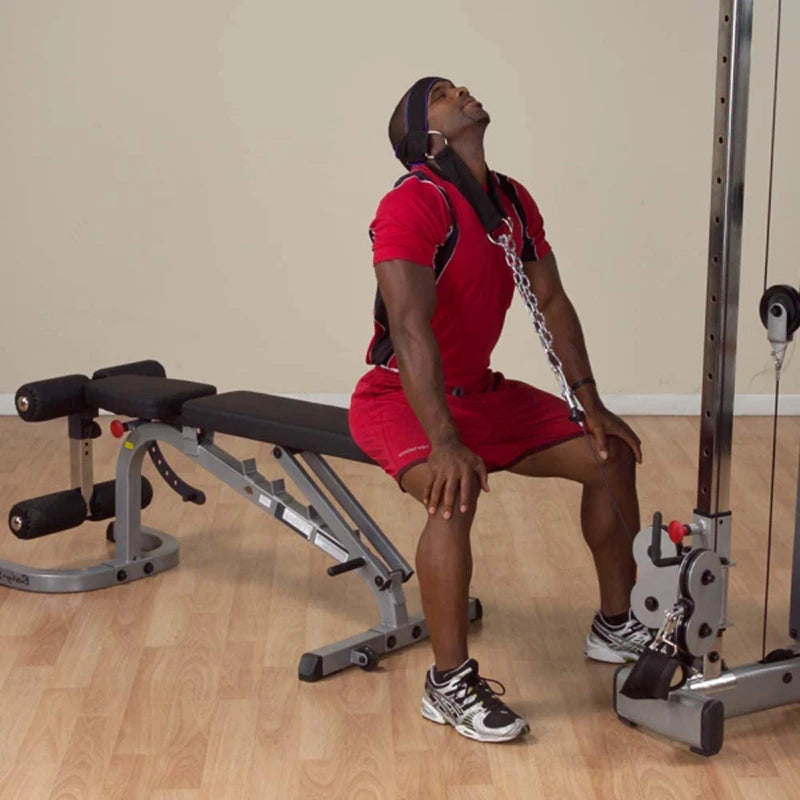Neck weight harness worn with steel chain attached during gym exercise