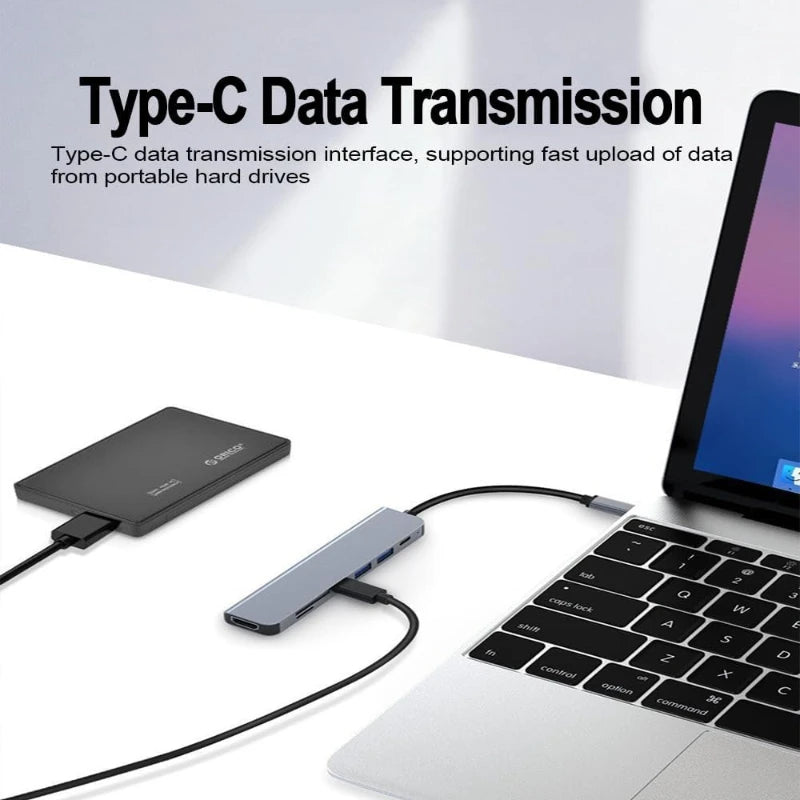 USB-C data hub with connected cable, showing multiple USB ports on the hub
