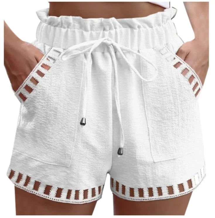 White cotton-linen shorts with elastic waist, drawstring, side pockets, cutout trim