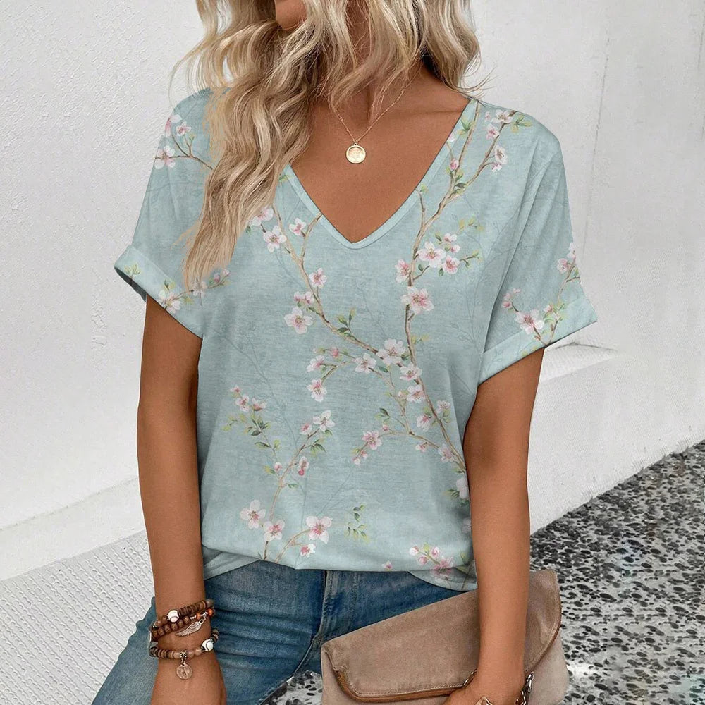 Women's plus-size V-neck T-shirt, light blue with small pink floral print.