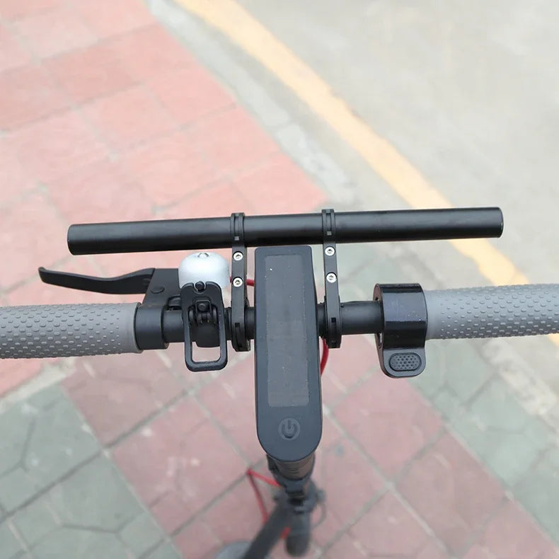 Handlebar extender with front mount plate and adjustable arms on black grips