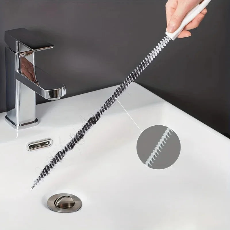 Flexible sink hair clog cleaning brush with white handle and spiral bristles extended