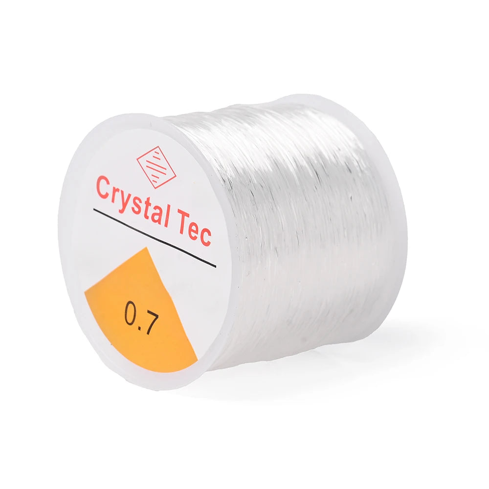 White elastic cord spool labeled 0.7mm, Crystal Tec