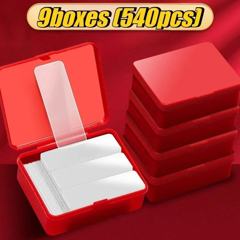 Double-sided adhesive mounting tape strips in red plastic organizer boxes