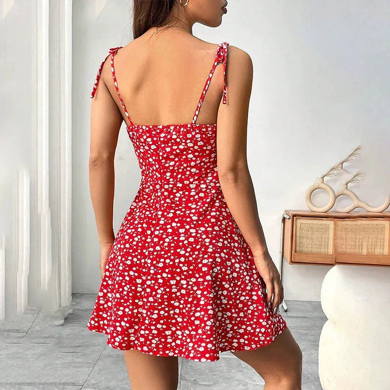 Red floral spaghetti-strap mini dress with open back and tie strap details