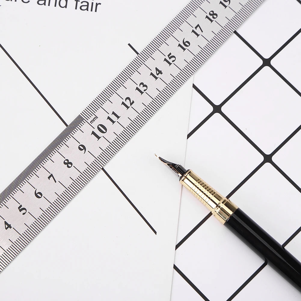 Stainless steel ruler placed diagonally over grid paper with pencil point nearby