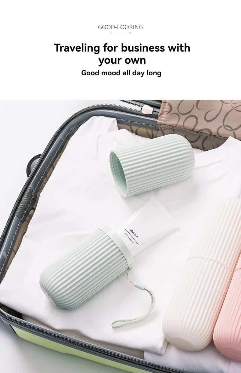 Ribbed toothbrush holder cases in mint, white, and pink placed in a travel bag