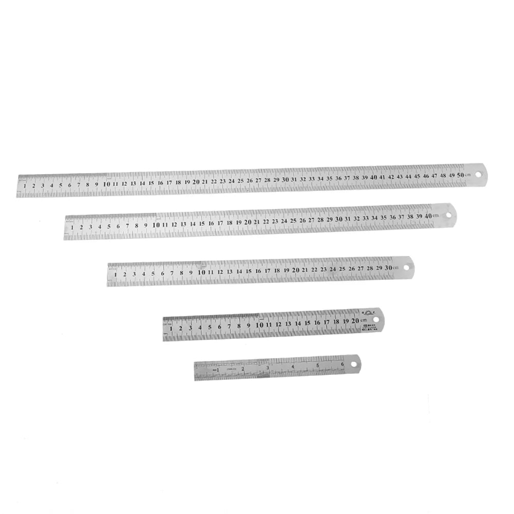 Set of straight metal rulers with printed measurement scales
