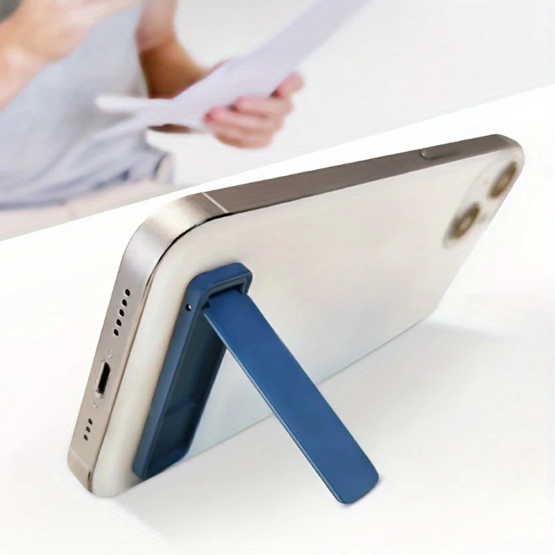 Blue foldable phone back sticker stand, metal bracket holding a phone at an angle