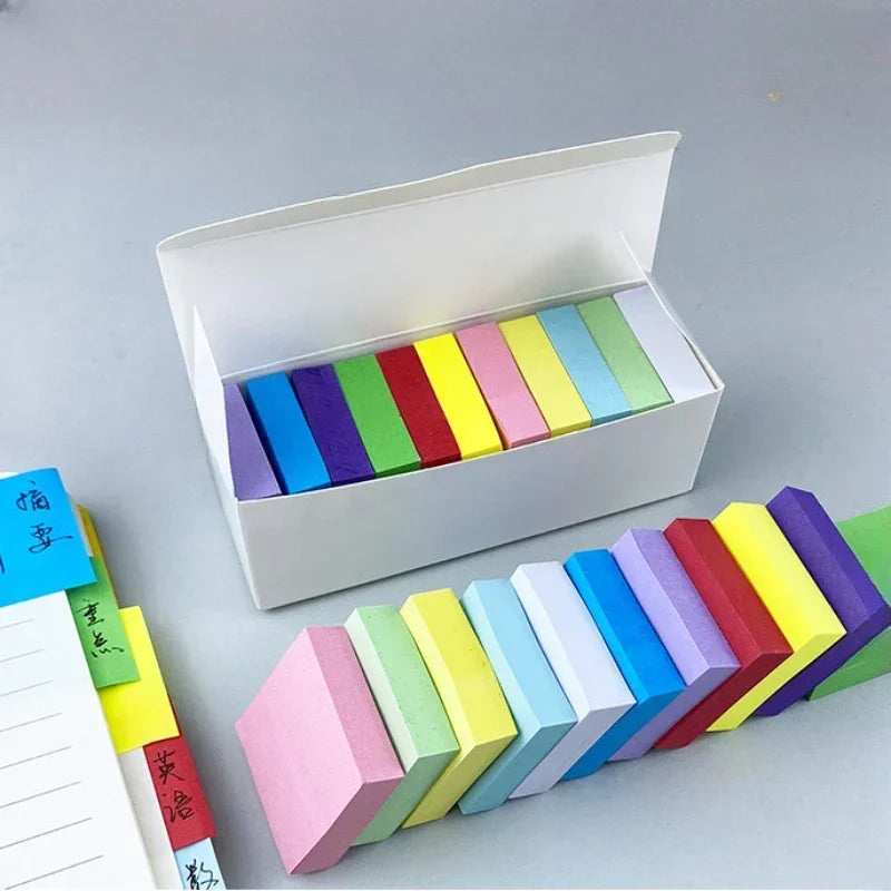White box holding multiple fluorescent bookmark-style sticky notes with assorted colors.