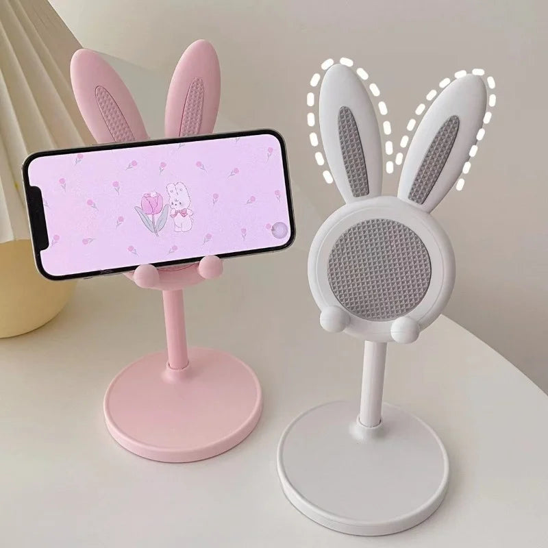 Pink and white rabbit phone stand pair, both with round mesh heads on bases