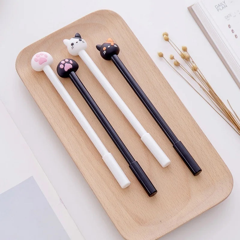 Kawaii cat gel pen set (10-pack) on a tray: white and black pens with paw designs