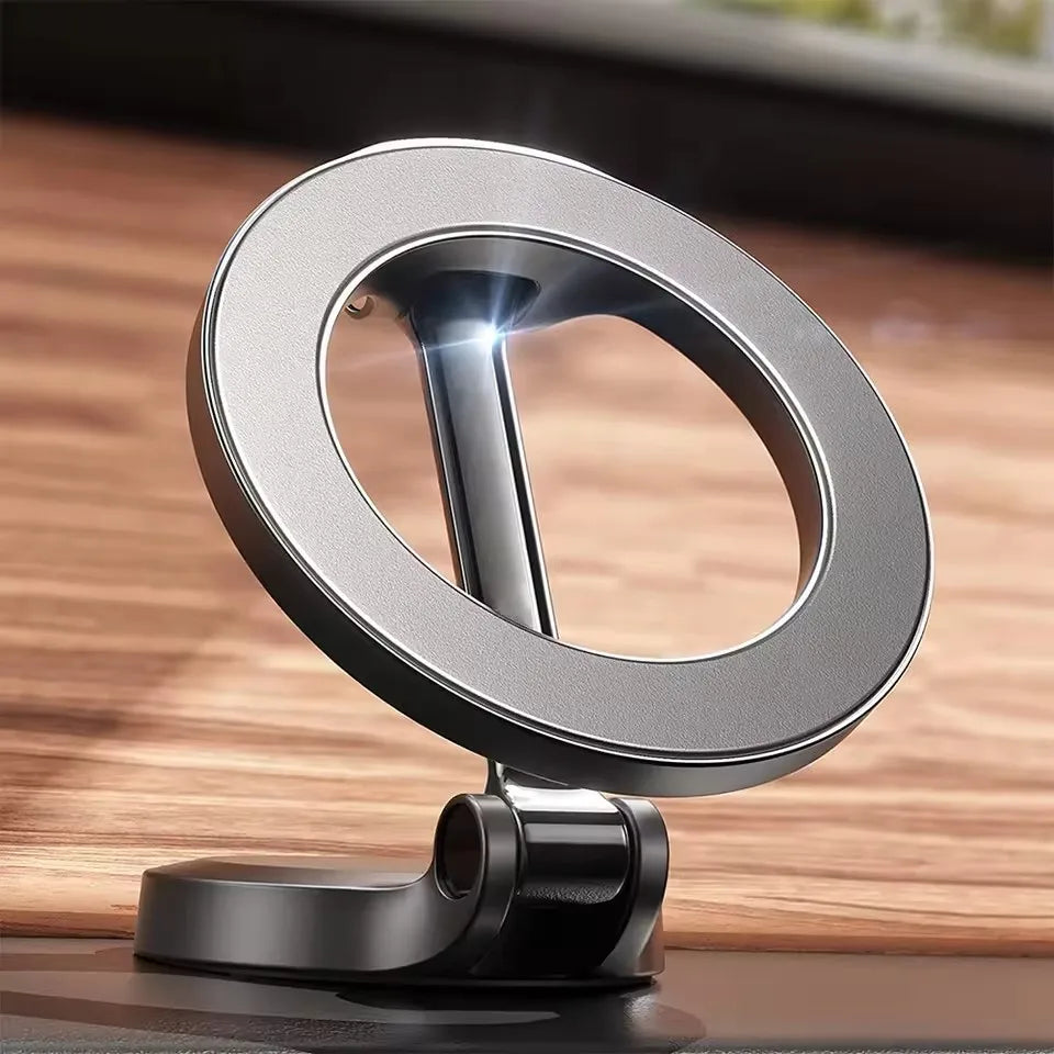 Black foldable MagSafe car phone holder with round magnetic ring on a stand