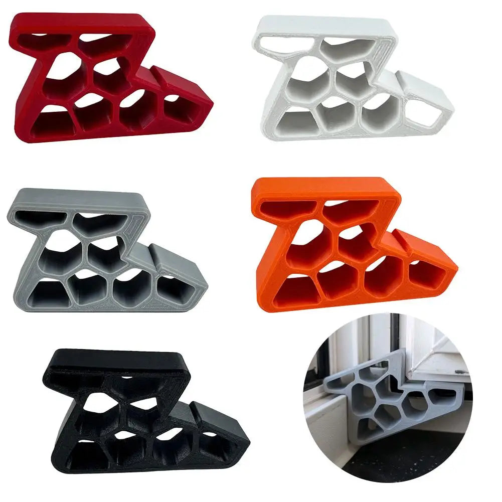 Door stopper wedges in red, white, gray, orange, and black with anti-slip cutouts