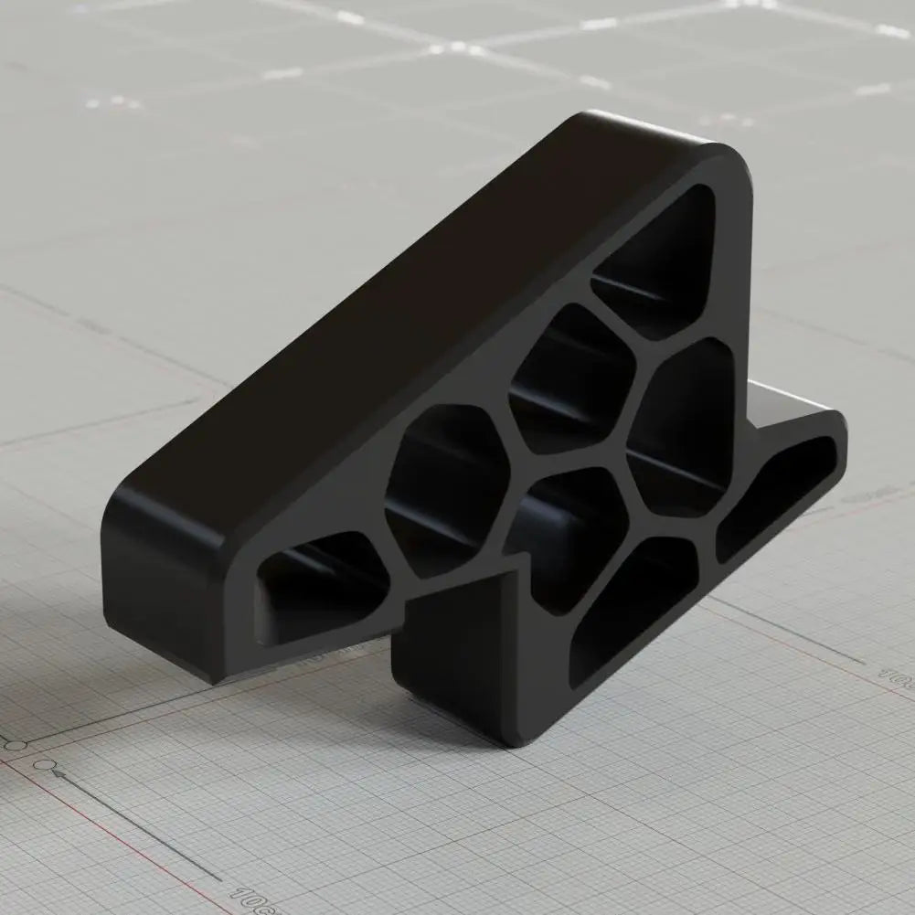 Black door stop wedge with track lock, honeycomb grip pattern, and anti-slip feet
