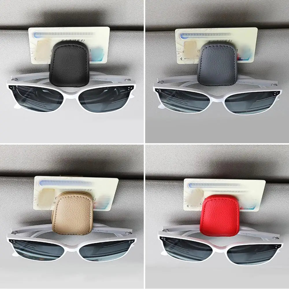 Car glasses clip holder in black, gray, beige, and red clipped to sunglasses on visor.