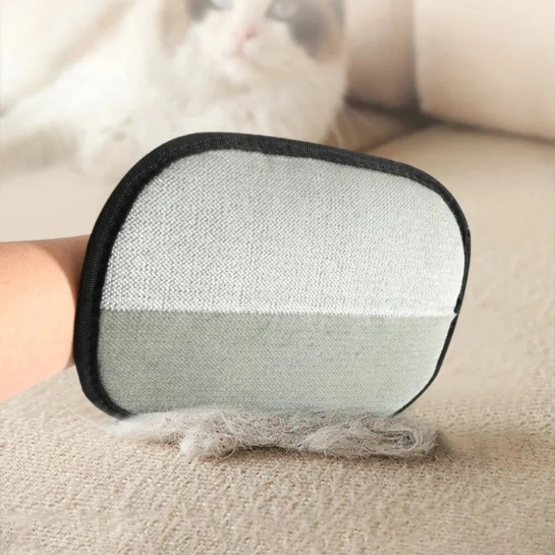 Double-sided pet grooming mitt with gray brush side and black edging, yellow tab
