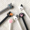Kawaii cat gel pens set with white and black barrels, cat-face and paw toppers