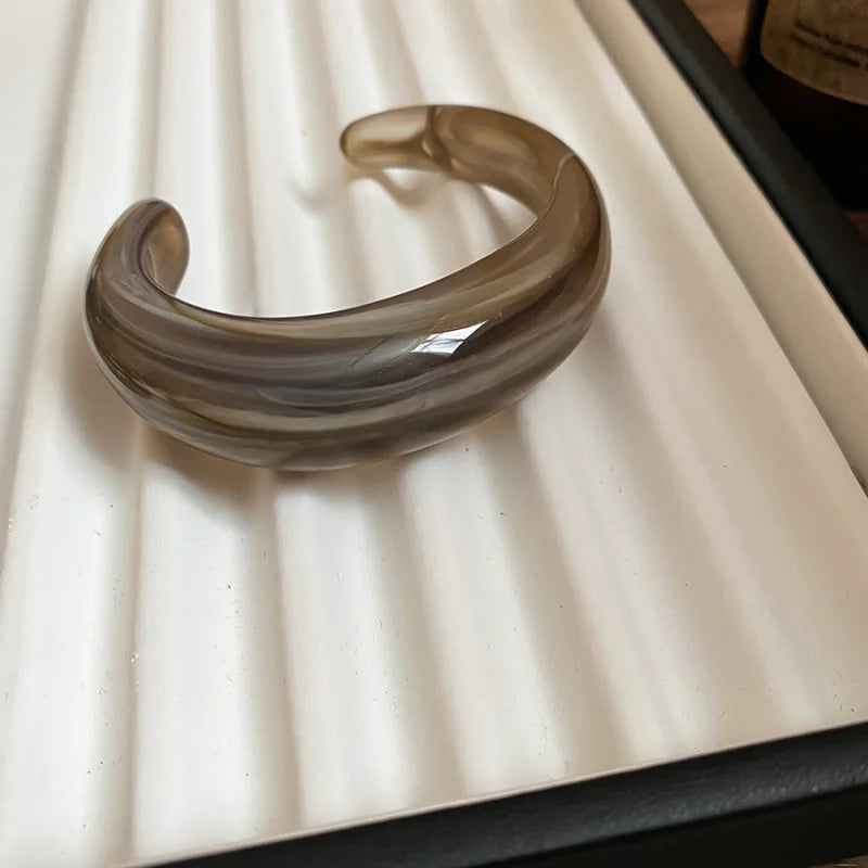 Shiny acrylic open bangle in taupe brown, wide curved glossy bracelet