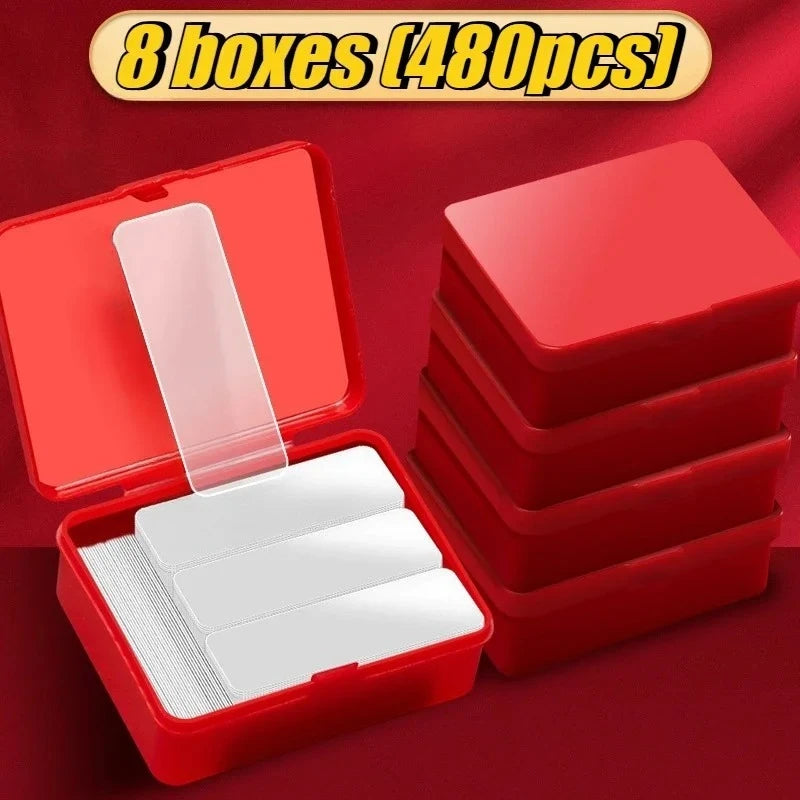 Double-sided adhesive tape pads kit with red case and several trays holding white double-sided pads