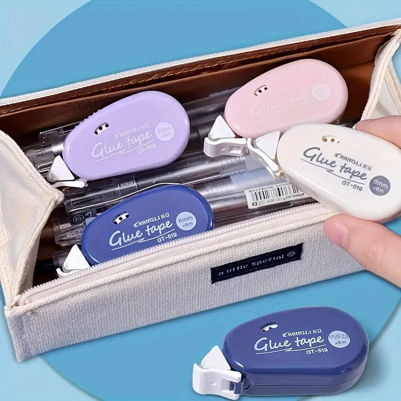 Assorted double-sided adhesive tape dispensers tucked into a pouch