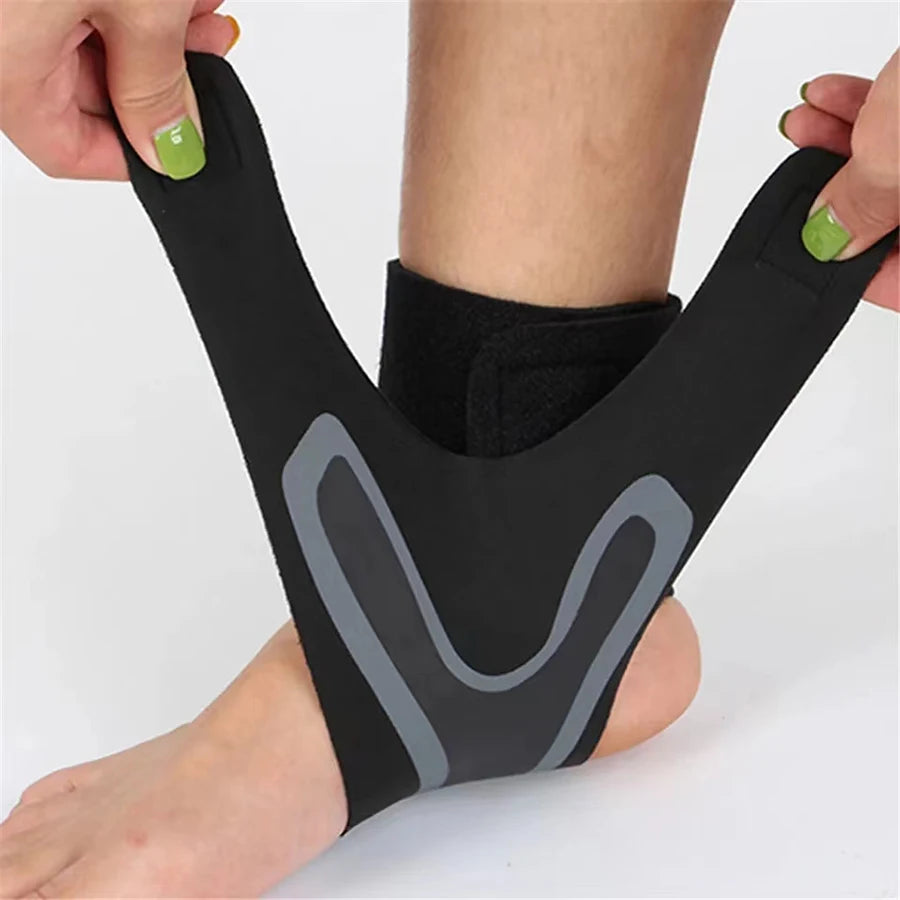 Black ankle compression sleeve held open by hands for easy wear