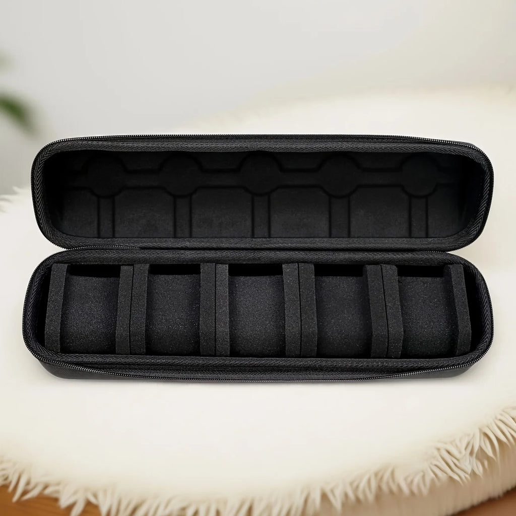 Black hard-shell watch case interior with foam inserts and stitched dividers.