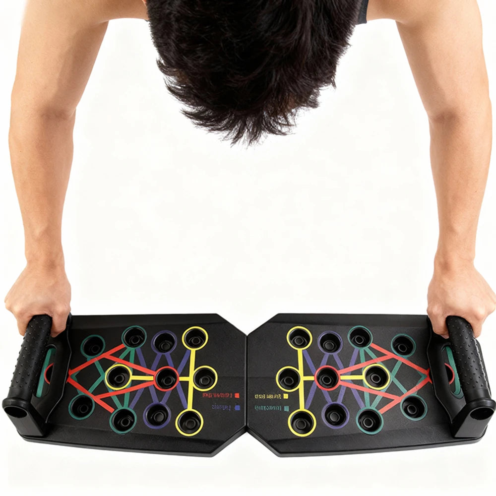Push-up board with colored workout layout, held by hands gripping foam handles