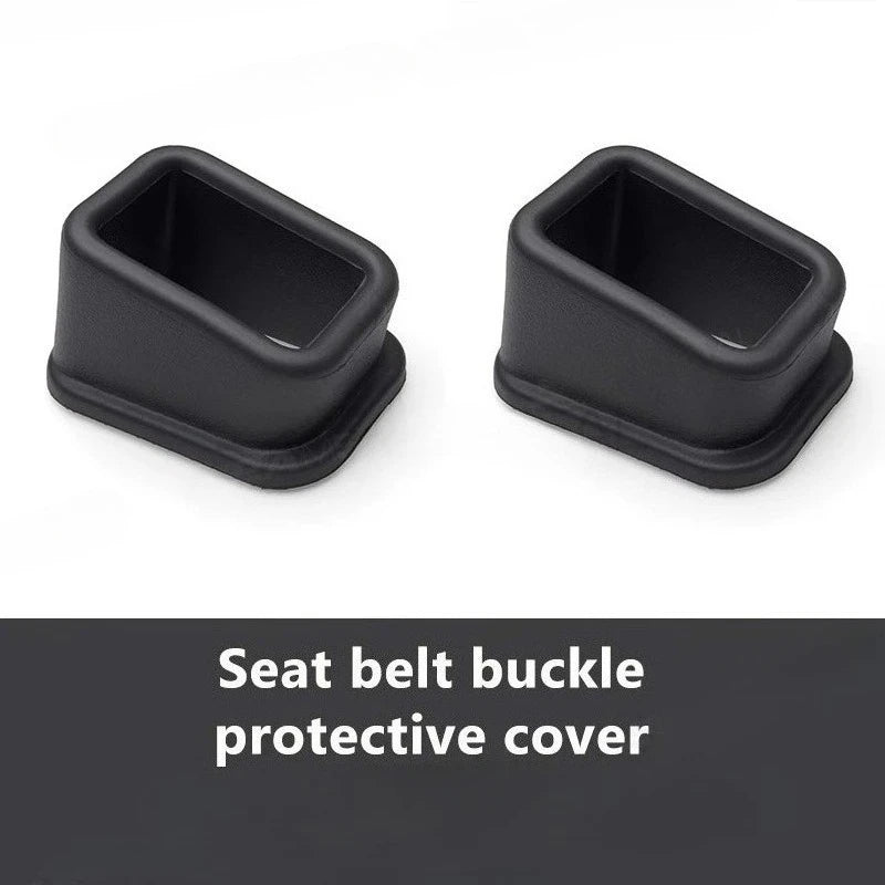 Two seat belt buckle protective covers, black open-cradle design on white background