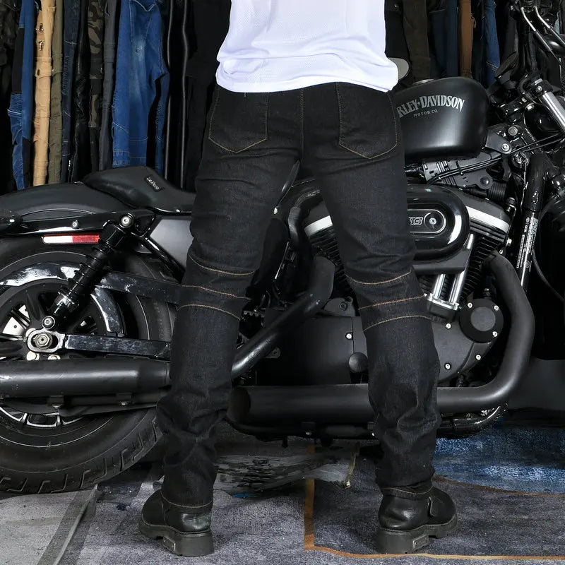 Black motorcycle rider jeans with stitched panels and padded knee and thigh protection