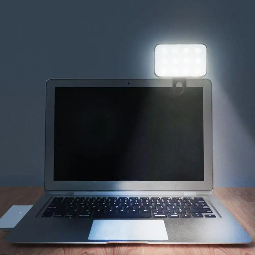 Pocket LED selfie light with clip mounted on open laptop screen