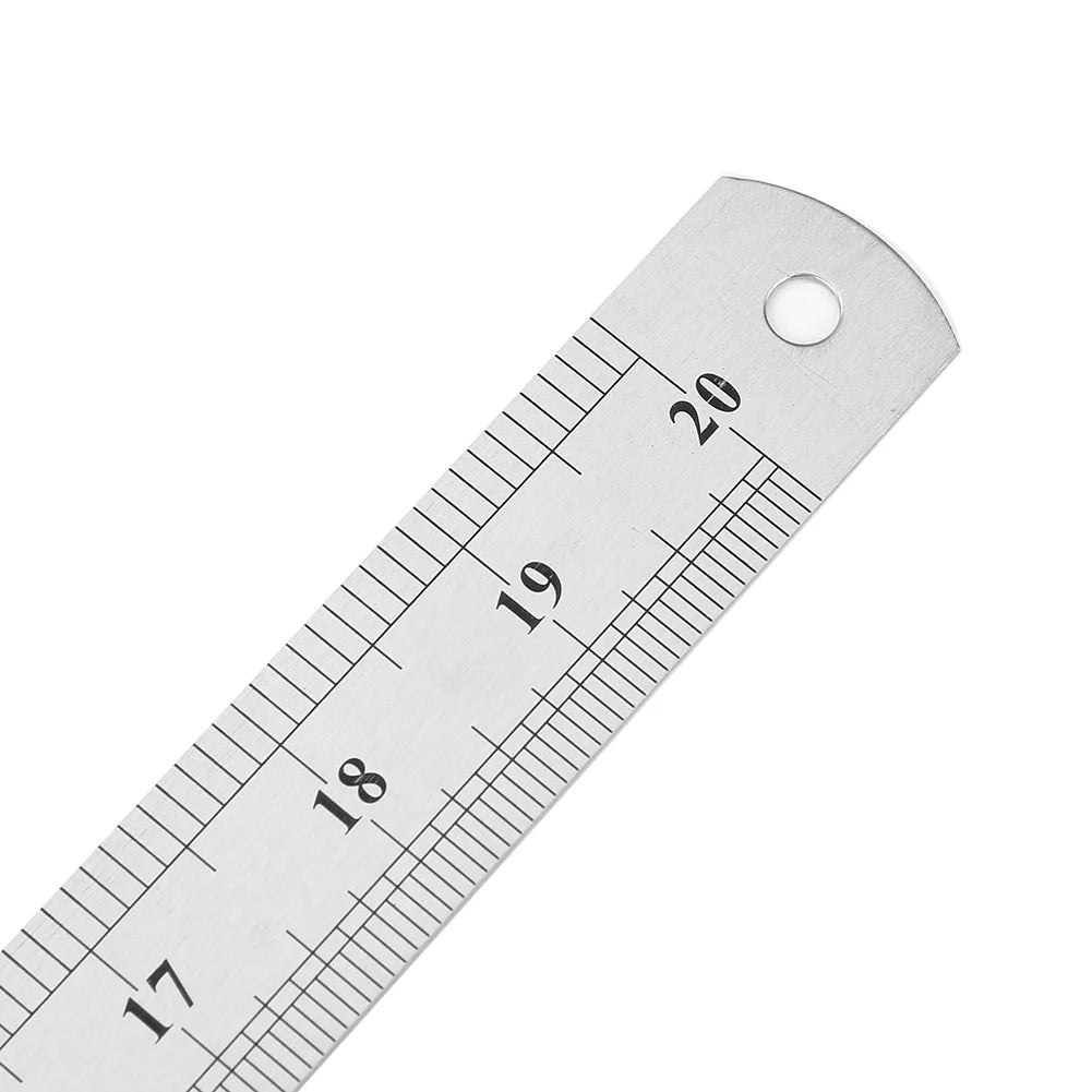 Close-up of stainless steel ruler showing measurement lines and numbers