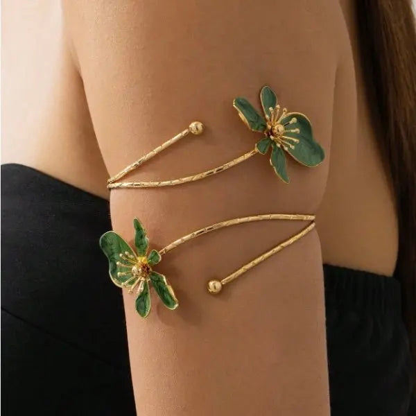 Floral open cuff armlet with green flower charms and gold-tone adjustable chain bracelet