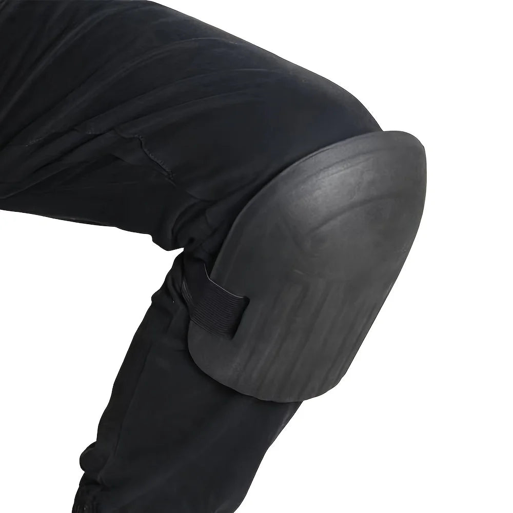 Black ergonomic knee pad with curved shell and adjustable elastic strap