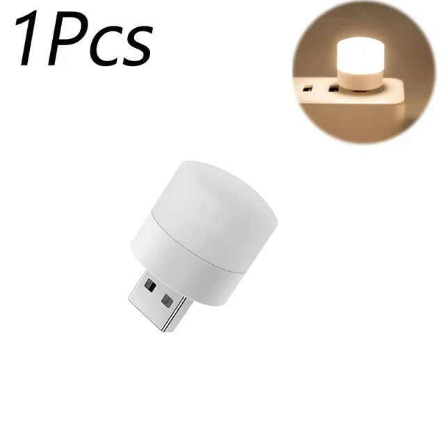 Single white USB mini night light bulb with glowing round top and USB plug
