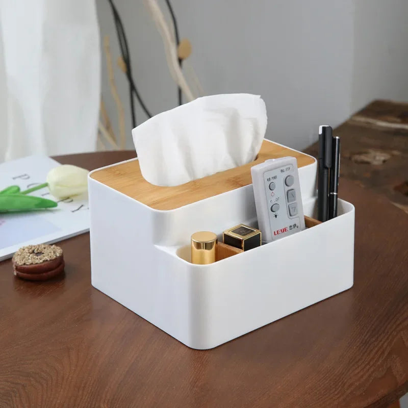 White plastic desktop organizer box with tissue opening and side slots for accessories