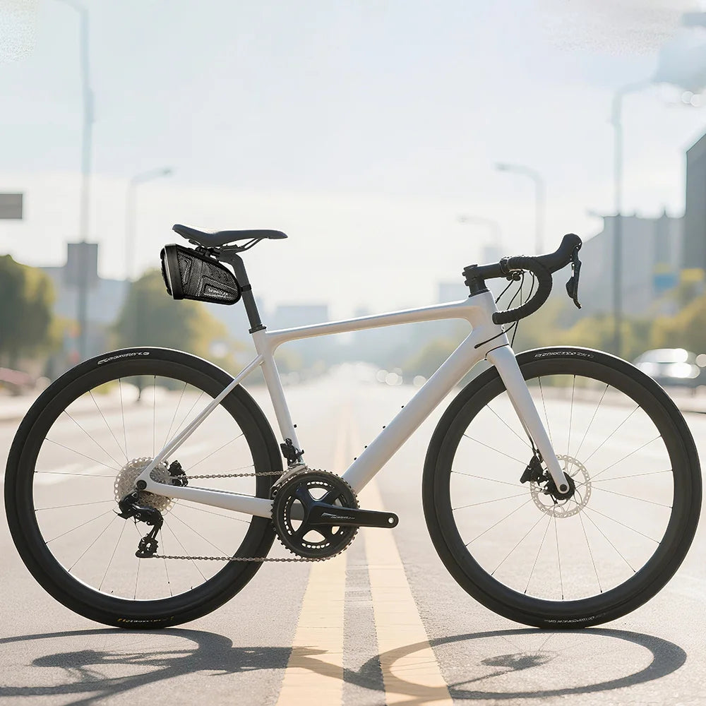 Waterproof black saddle tool bag mounted under the bike seat, reflective trim