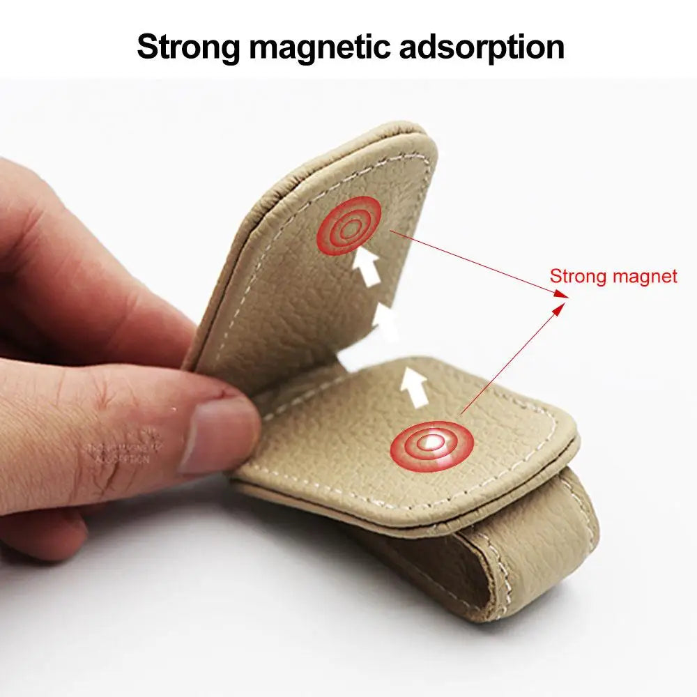 Beige magnetic car glasses clip holder with metal snap back and stitched leatherette.