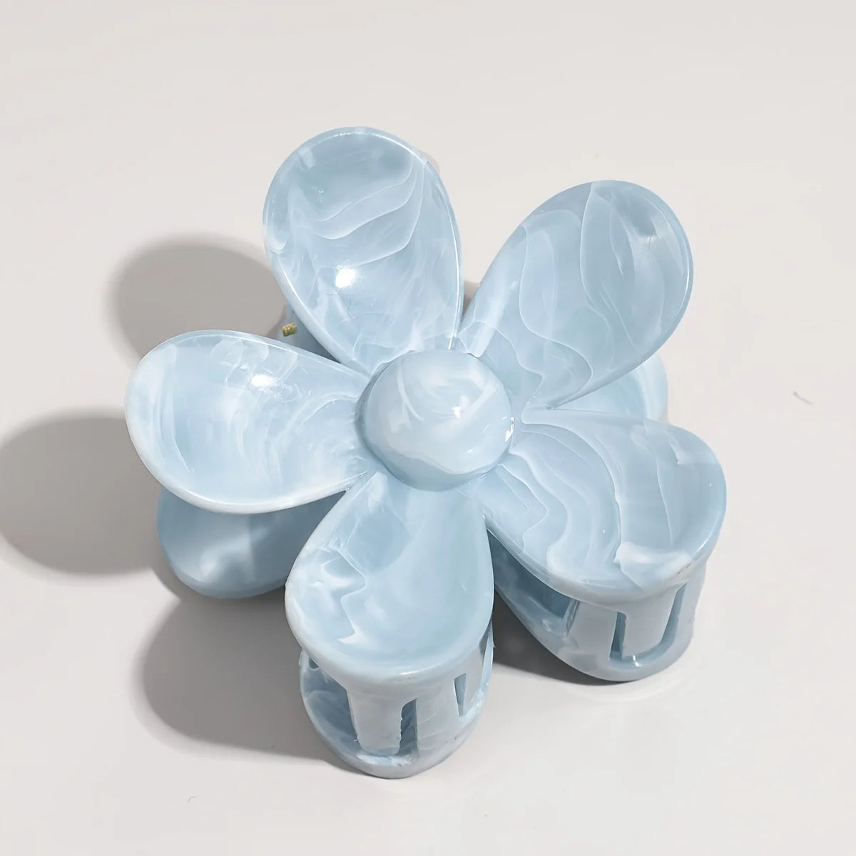 Light blue translucent flower-style bow hair claw with layered petal clips