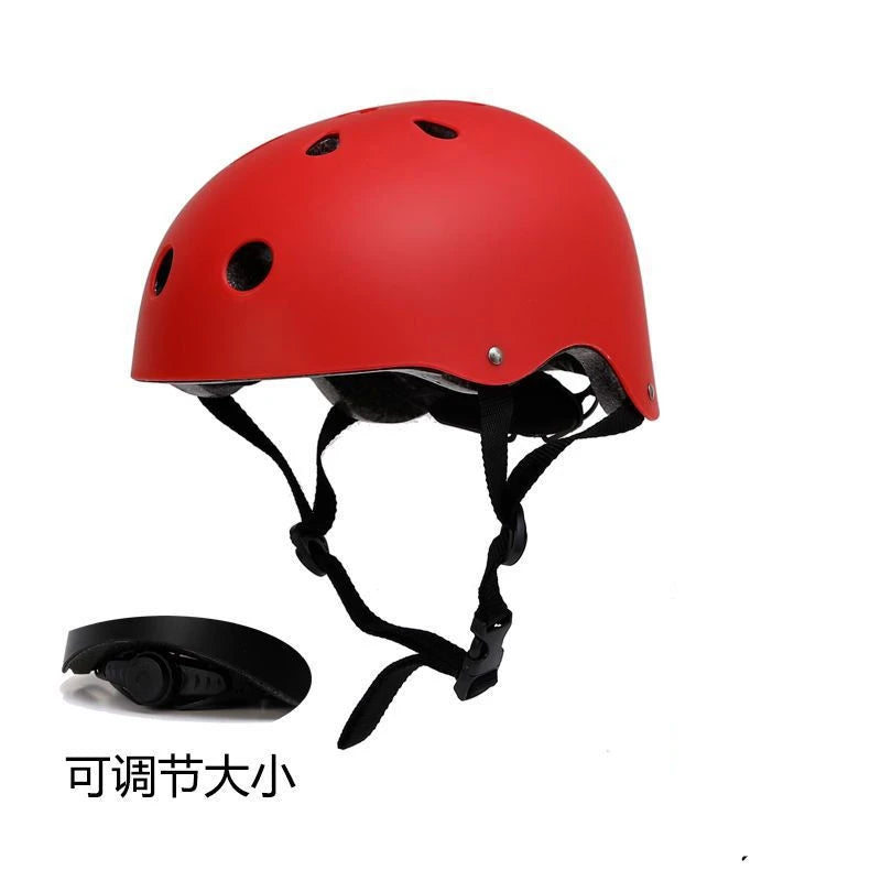 Red kids bike helmet with ventilation holes and black chin straps, side view.