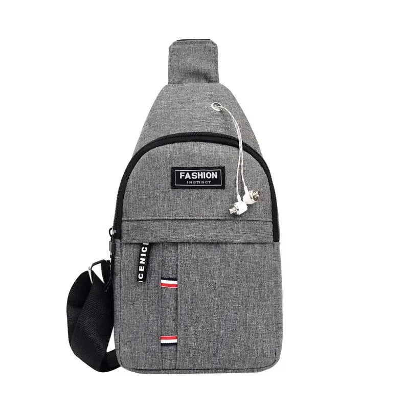 Gray crossbody fanny pack with adjustable strap, front pocket, and logo patch