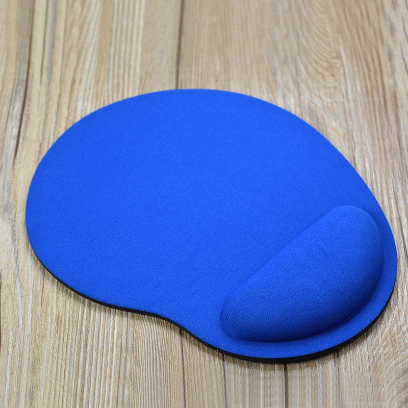 Blue mouse pad with wrist rest, smooth top and rounded ergonomic shape