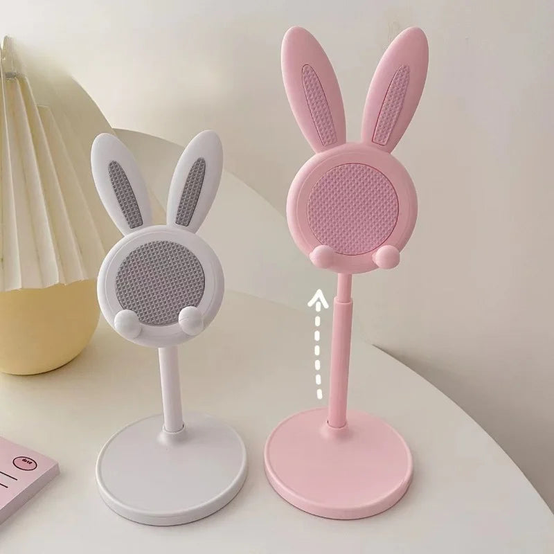 Pink and white rabbit phone stands with bunny ears and round mesh top pads