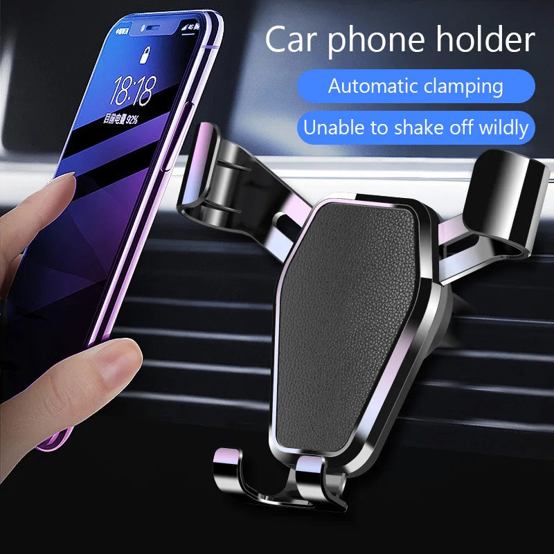 Black gravity car phone holder with textured grip pad and dual vent-side supports