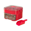 Red ice cube machine with clear side window and press lid, plus red scoop tool.