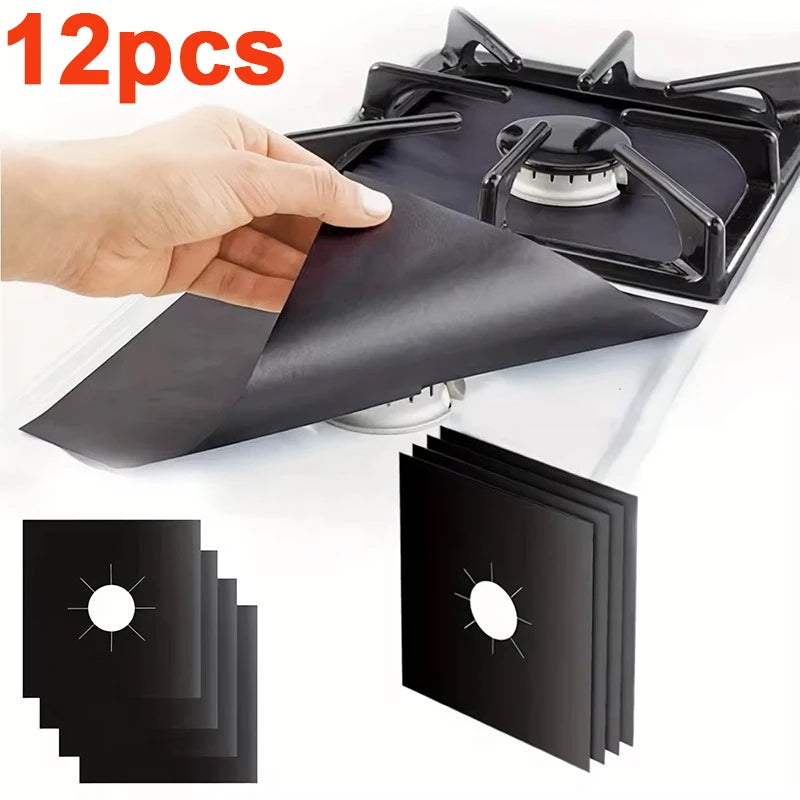 12-piece black stove protector liner set, hand lifting a pad over a gas burner