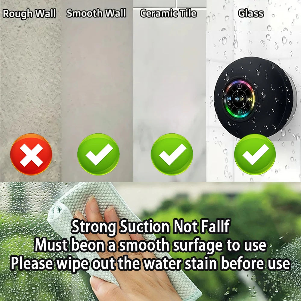 Black Bluetooth speaker with glowing RGB ring and water droplets, suitable for wet-surface suction mounting